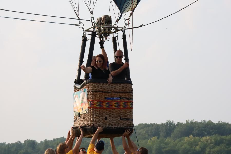 riders in balloon basket