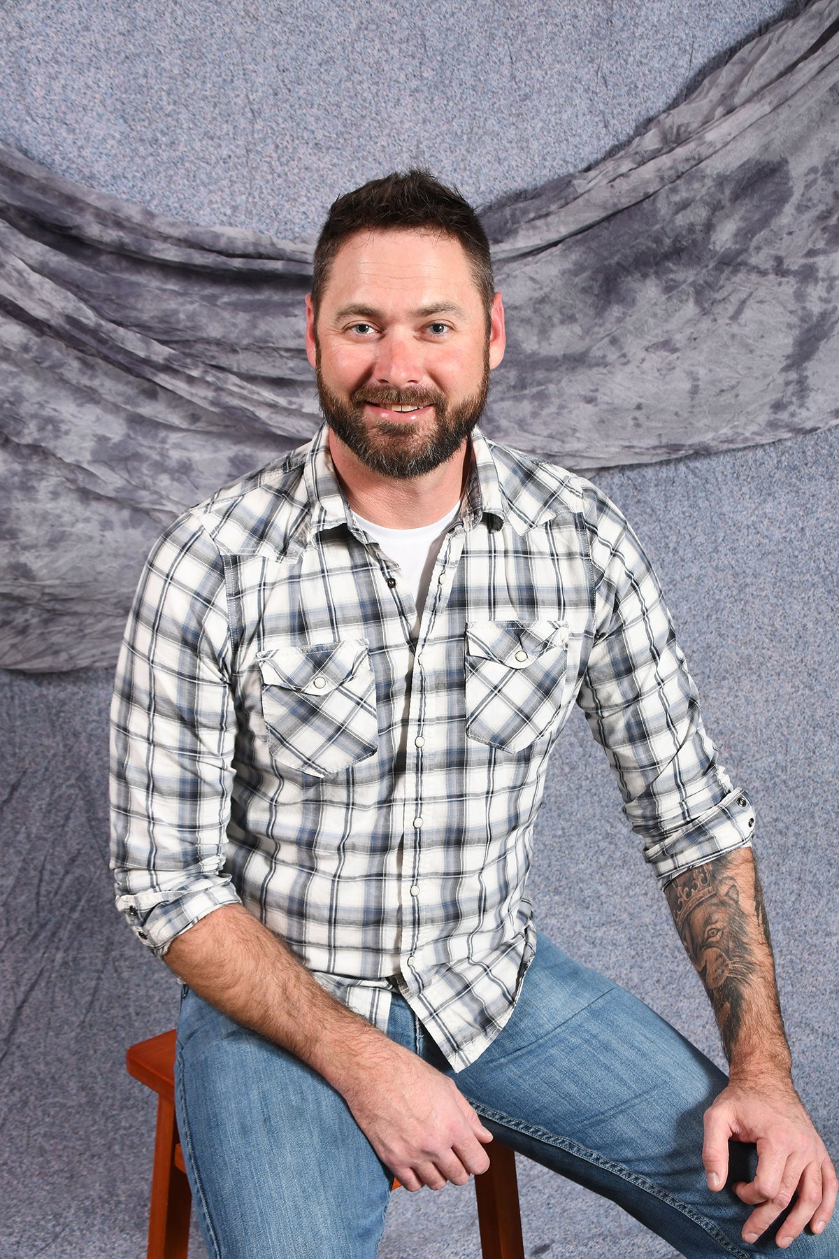 man sitting on stool