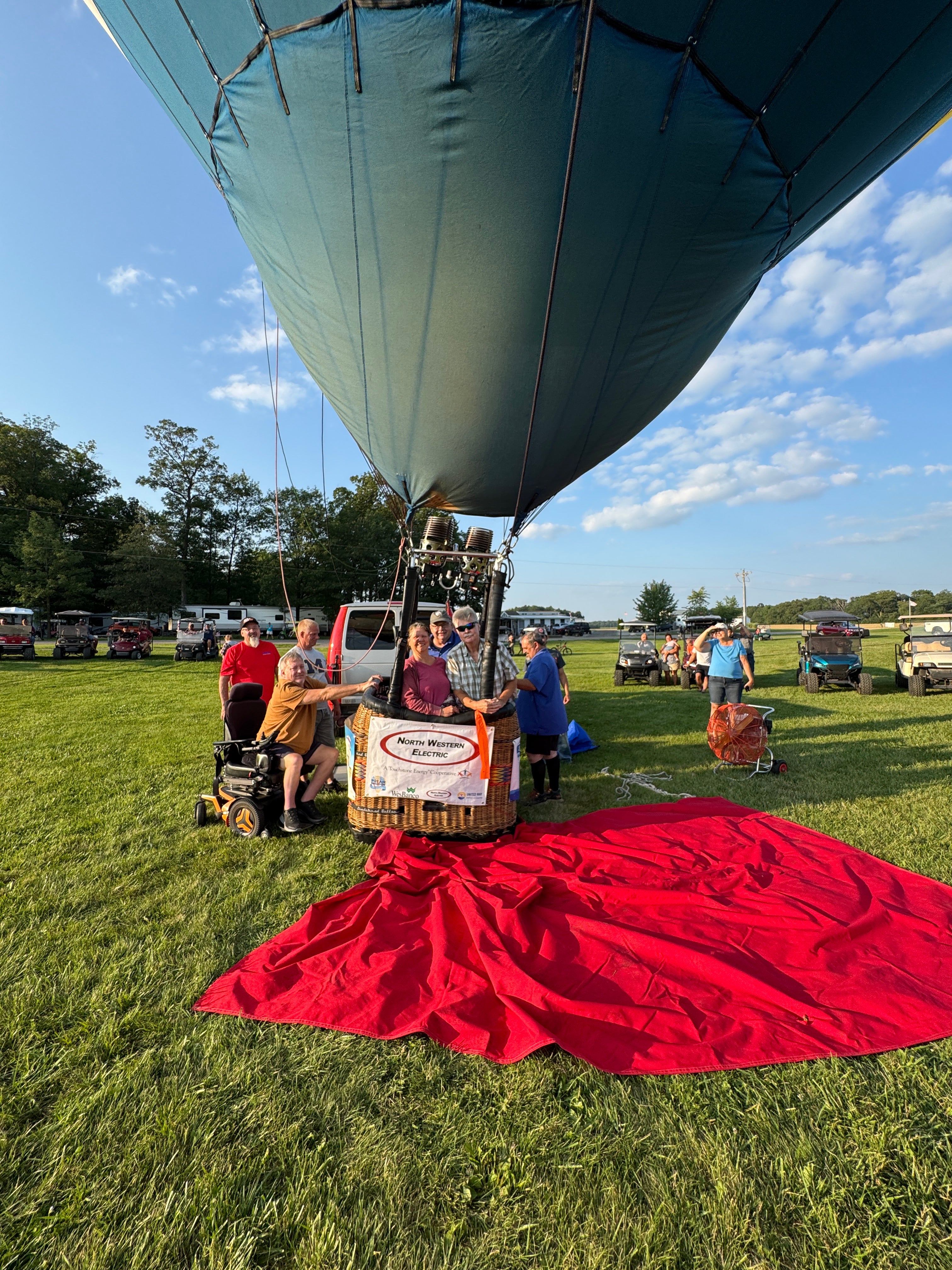 winner Ray Strup and his sister in the balloon basket with pilot Scott Wooge